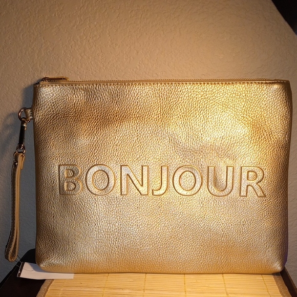 Imoshion Handbags - NWOT IMOSHION Bonjour Au Revoir Gold Vegan Leather Wristlet Purse Makeup Bag